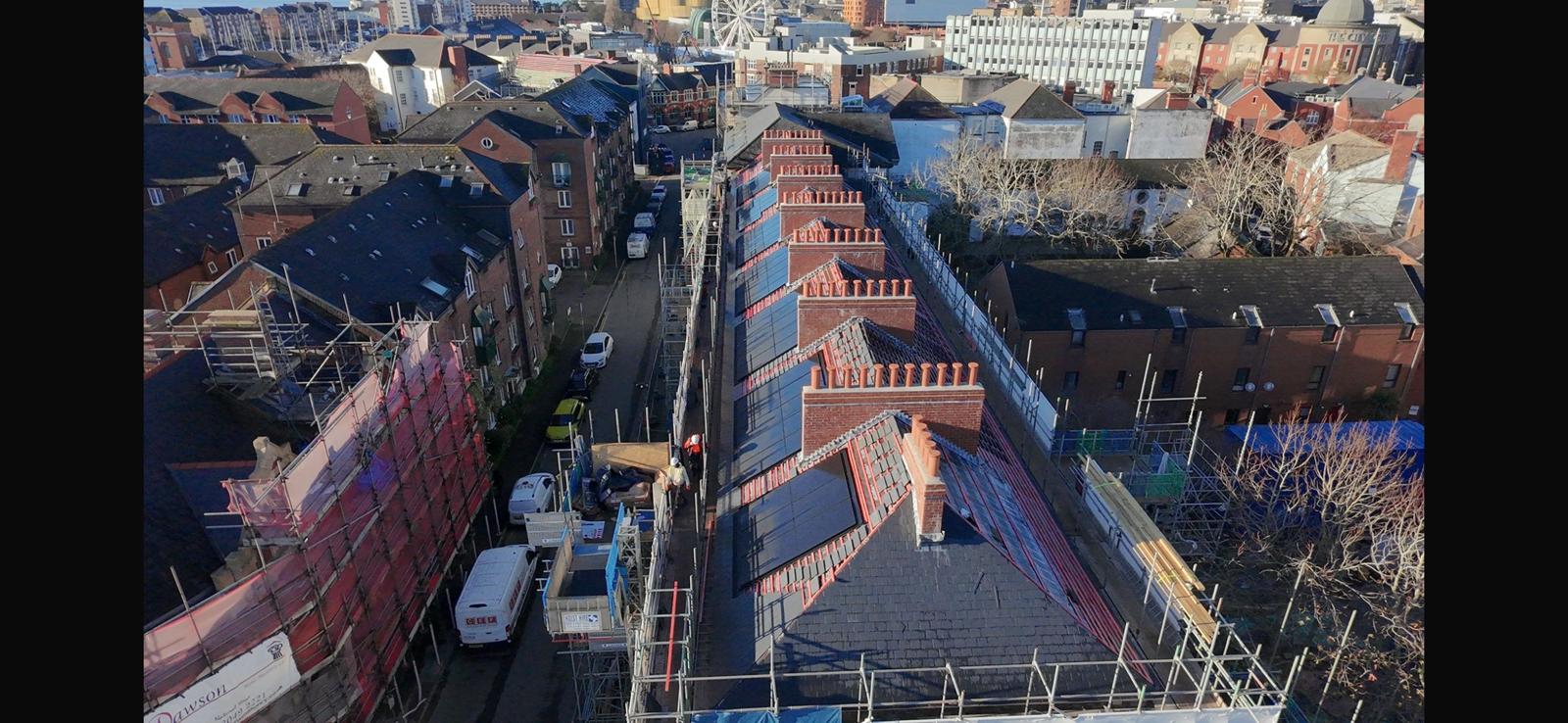 Wider roofscape view of Cambrian Place solar PV installation