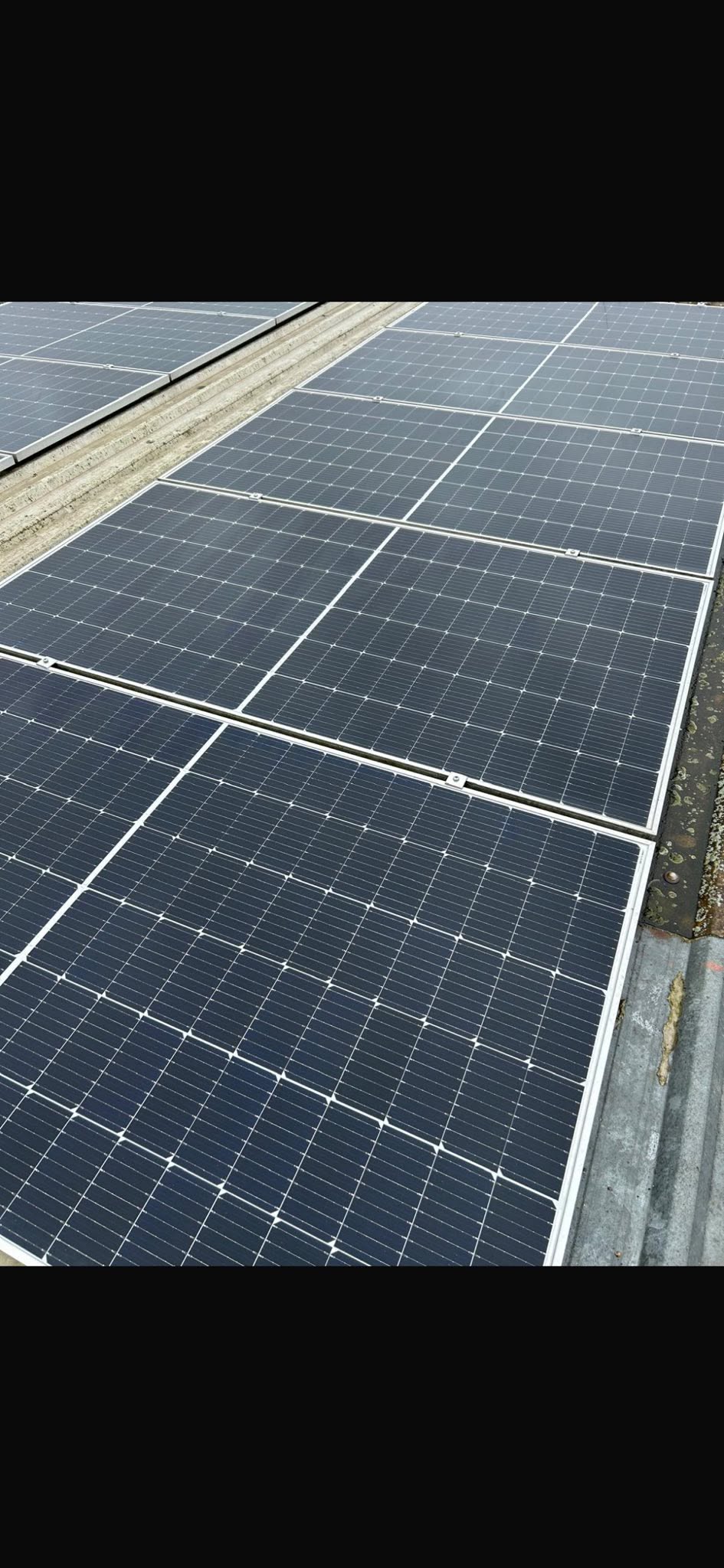 Solar panels restored to clean condition after an FLD maintenance clean, South Wales